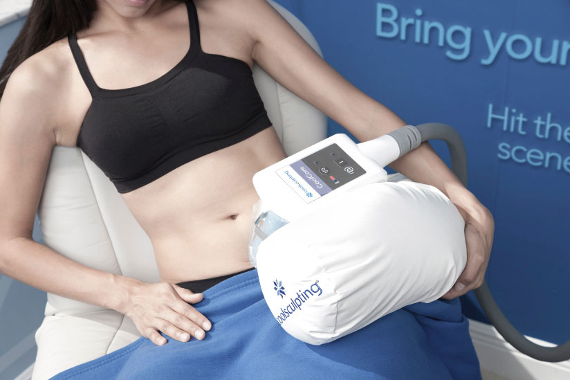 A young woman receiving Coolsculpting therapy at Melamed Weight and Wellness, a medical spa in Deerfiled, IL