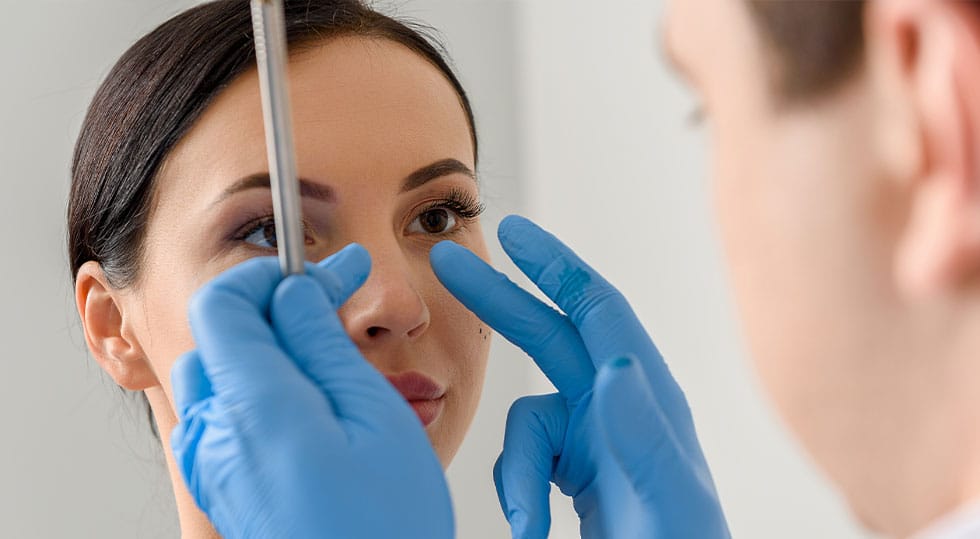 woman receiving a consultation for a non-surgical nose job in North Shore, IL