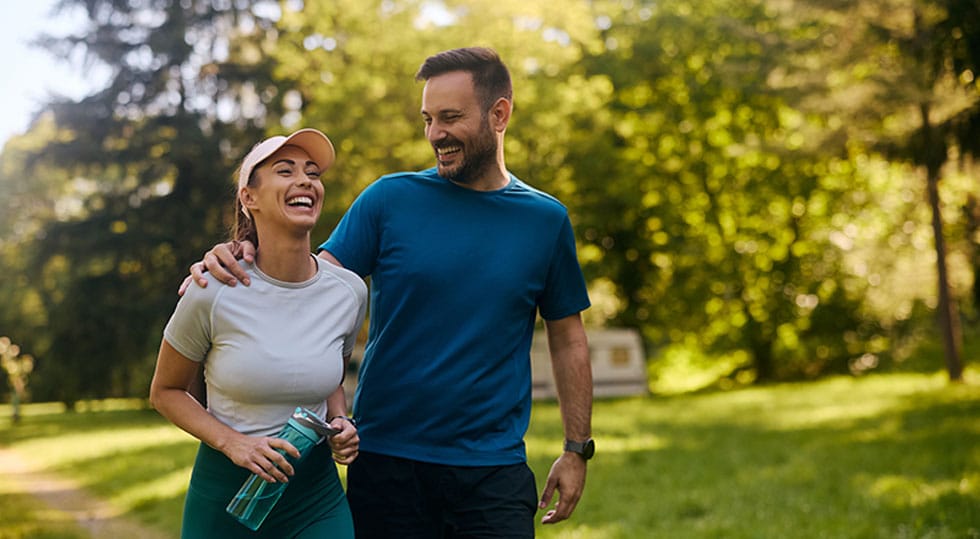 happy couple walking outside after starting peptide therapy in Deerfield, IL