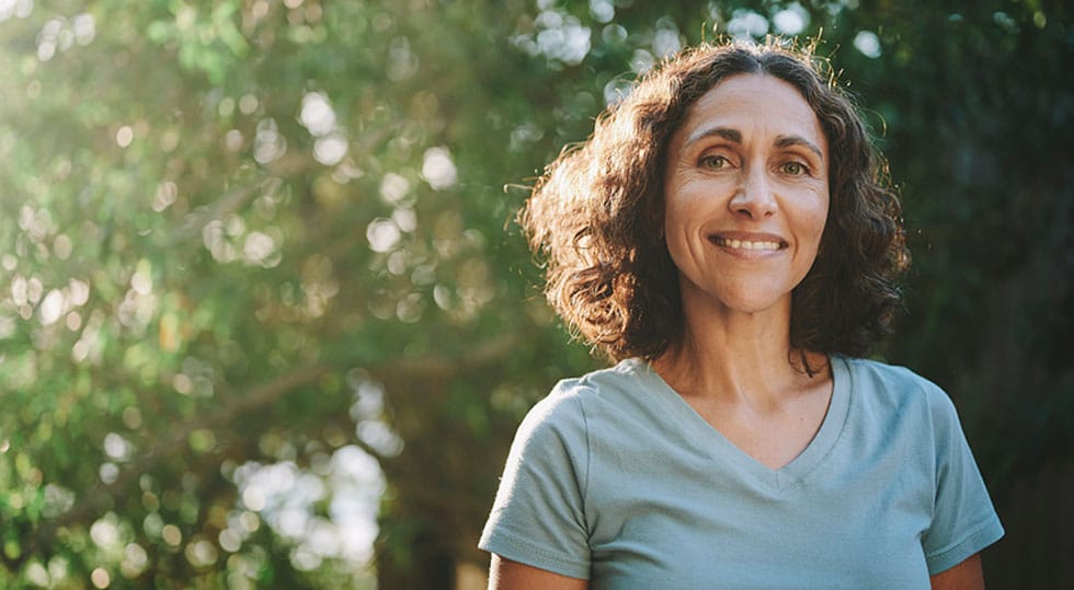 older woman smiling after starting peptide therapy in Deerfield, IL